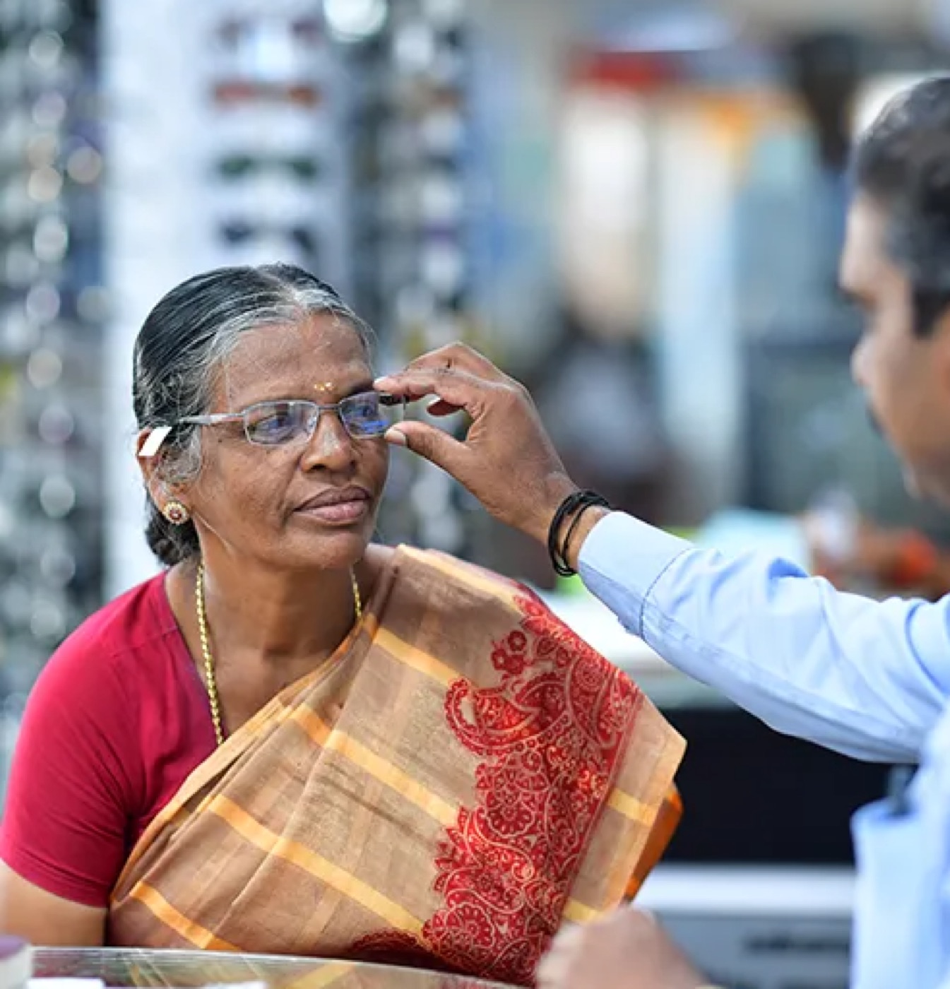 Fitting a new pair of glasses at the optical counter